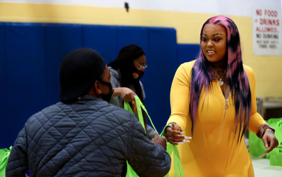 <strong>Memphis rapper Jucee Froot, whose real name is Terrica Shanice Alexander, helps distribute food bags Saturday at Hollywood Community Center, 1560 N. Hollwyood Street.</strong> (Patrick Lantrip/Daily Memphian)