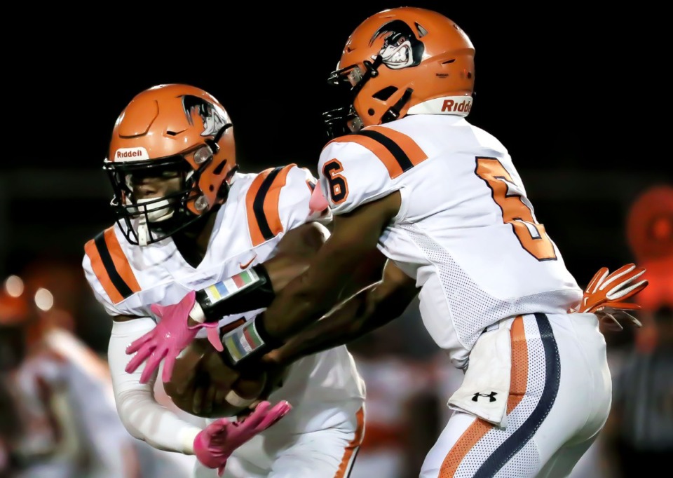 <strong>Ridgeway High School quarterback Jeremiah Lucas (6) hands off the ball to running back Quintarrius Ayers (4) during an Oct. 8 game against Kirby High School.</strong> (Patrick Lantrip/Daily Memphian file)