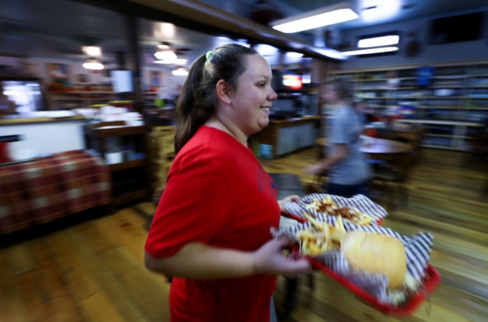 <strong>Sarah Matlock carries out a plate of food at the Barrettville General Store on Saturday, Nov. 20.</strong> (Patrick Lantrip/Daily Memphian)