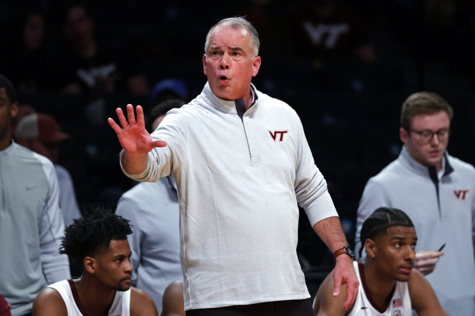 <strong>Virginia Tech coach Mike Young directs the team against Memphis during the first half of an NCAA college basketball game in the NIT Season Tip-Off tournament Wednesday, Nov. 24, 2021, in New York.</strong> (AP Photo/Adam Hunger)
