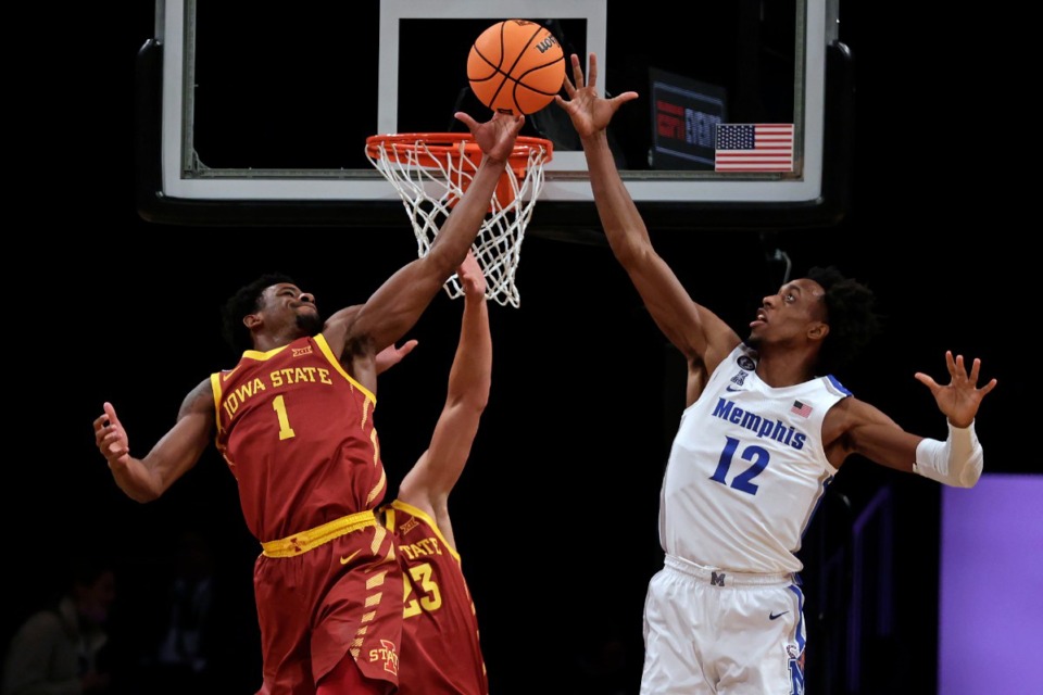 <strong>Iowa State's Izaiah Brockington (1) grabs a rebound over Memphis' DeAndre Williams (12) during the first half of an NCAA college basketball game in the NIT Season Tip-Off tournament Friday, Nov. 26, 2021, in New York.</strong> (AP Photo/Adam Hunger)