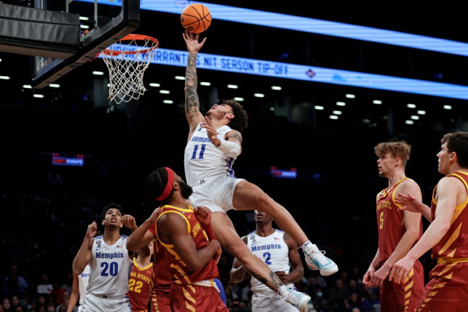 <strong>Memphis' Lester Quinones (11) is fouled by Iowa State's Tre Jackson during the second half of an NCAA college basketball game in the NIT Season Tip-Off tournament Friday, Nov. 26, 2021, in New York. Iowa State won 78-59.</strong> (AP Photo/Adam Hunger)