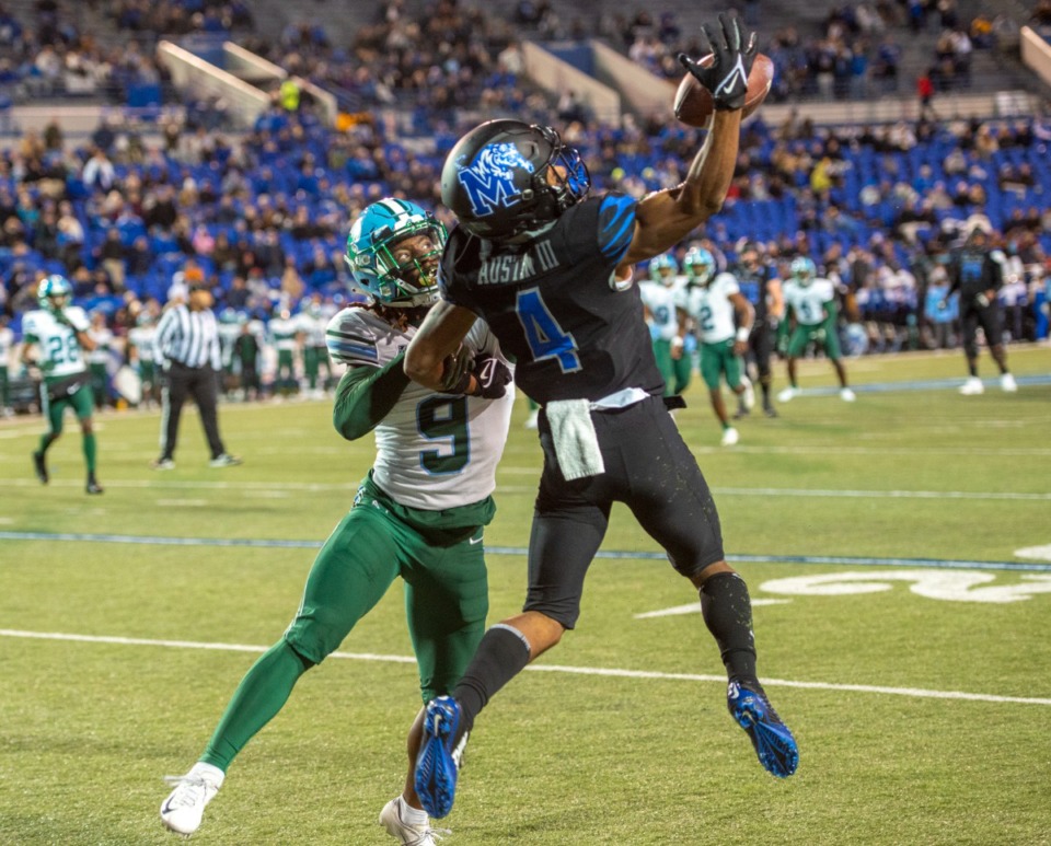<strong>Memphis wide receiver Calvin Austin III goes up for a pass as Tulane cornerback Jaylon Monroe pulls on his arm in the final plays of the first half of this year's final regular season game Saturday, Nov. 27, 2021.</strong> (Greg Campbell/Special to The Daily Memphian)