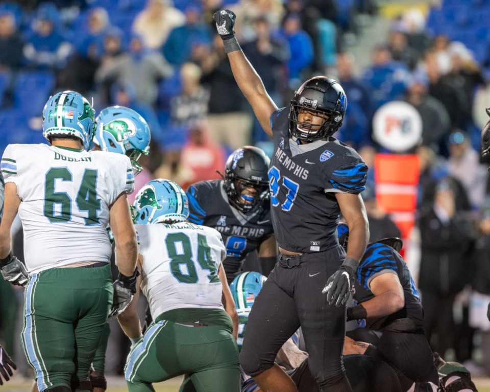 <strong>Memphis defensive end Wardalis Ducksworth signals Memphis&rsquo; ball after a fumble by Tulane in the fourth quarter of the final regular season game Saturday, Nov. 27, 2021. Memphis held on to win 33-28.</strong> (Greg Campbell/Special to The Daily Memphian)