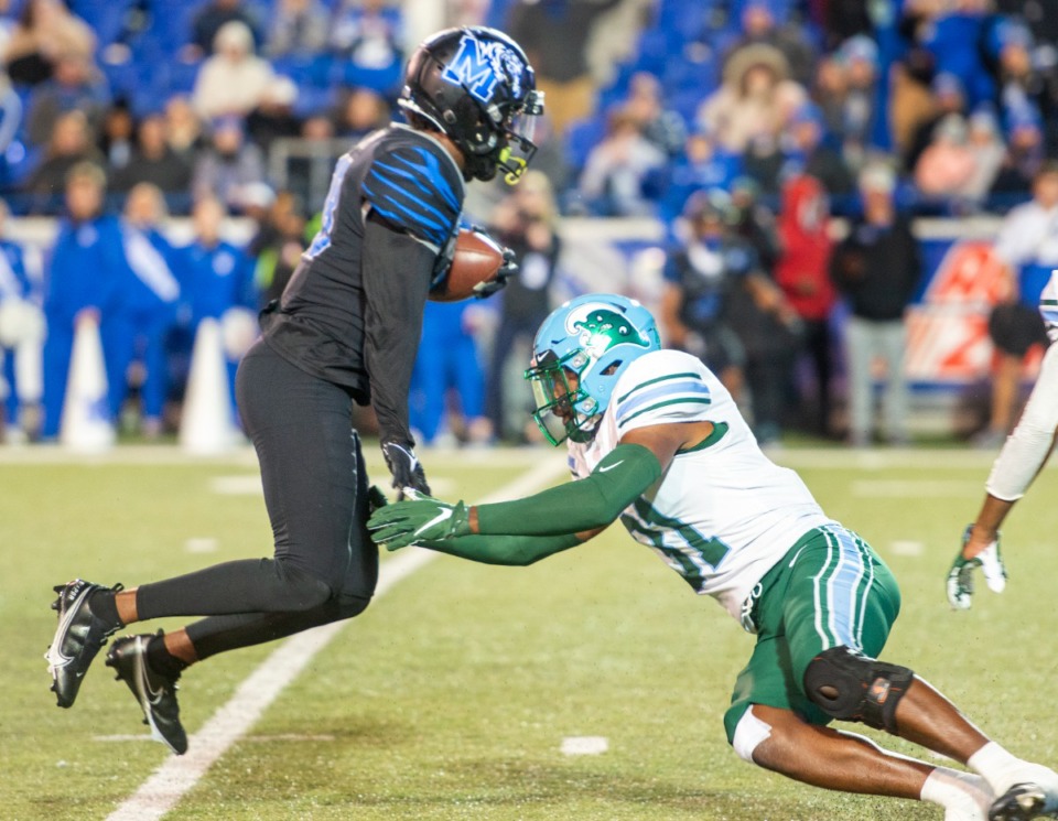 <strong>Memphis wide receiver Eddie Lewis avoids a tackle by Tulane's Larry Brooks on the 10 yard line on his way to scoring a touchdown in the Memphis win over Tulane 33-28 on the final regular season game Saturday, Nov. 27, 2021.</strong> (Greg Campbell/Special to The Daily Memphian)