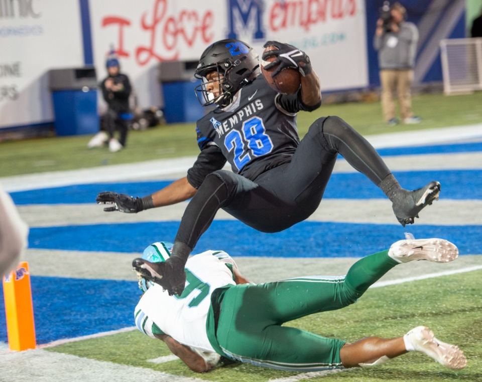 <strong>Asa Martin is knocked out on the 1/2 yard after his reception late in the third quarter in Memphis' 33-28 win over Tulane in the final regular season game Saturday, Nov. 27, 2021.</strong> (Greg Campbell/Special to The Daily Memphian)