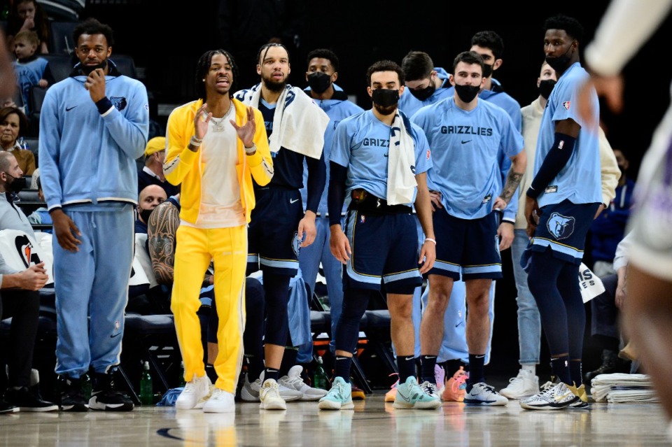 <strong>Memphis Grizzlies guard Ja Morant (second from left) calls to teammates from the bench in the first half of an NBA basketball game against the Sacramento Kings Sunday, Nov. 28, 2021, at FedExForum.</strong> (AP Photo/Brandon Dill)