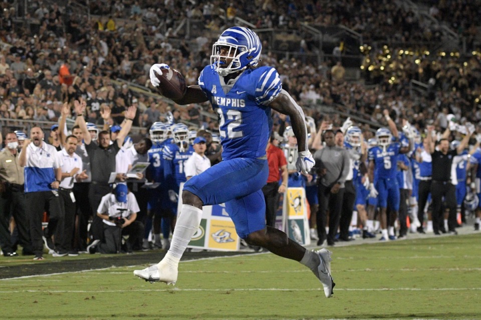 <strong>Memphis running back Brandon Thomas (22) rushed for a 9-yard touchdown against Central Florida on Friday, Oct. 22, 2021, in Orlando.</strong> (Phelan M. Ebenhack/Orlando Sentinel via AP)
