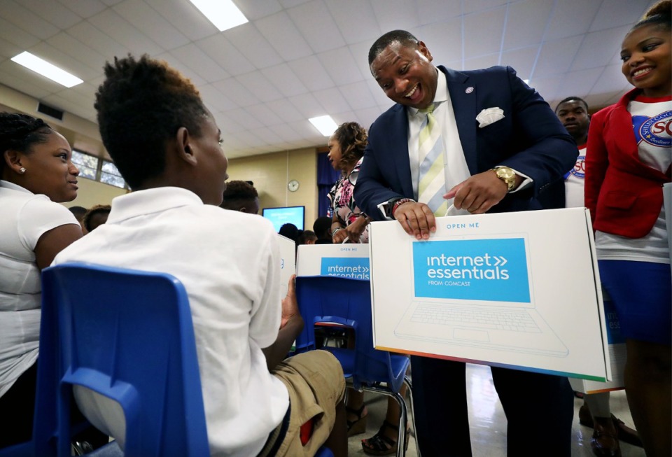 <strong>Shelby County Schools Superintendent Joris Ray surprises Cummings K-8 School students with a free laptop Aug. 6 as part of Comcast&rsquo;s Digital Inclusion Day in Memphis.</strong> (Patrick Lantrip/Daily Memphian)