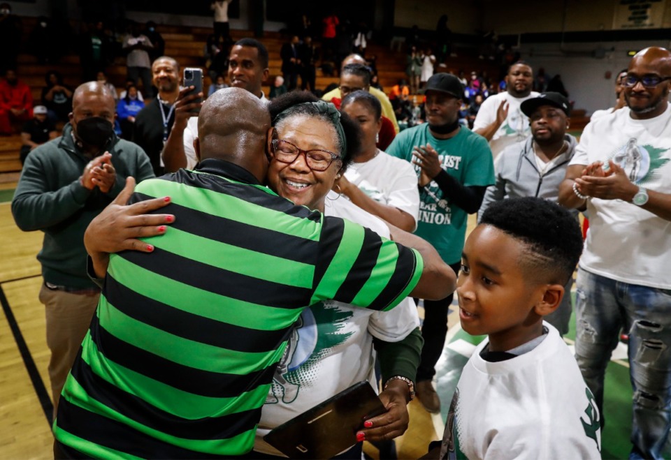 <strong>Gladys Young (middle), mother of the late Galen Young, celebrates during his jersey retirement ceremony at Hillcrest on Tuesday, Nov. 30, 2021.</strong> (Mark Weber/The Daily Memphian)