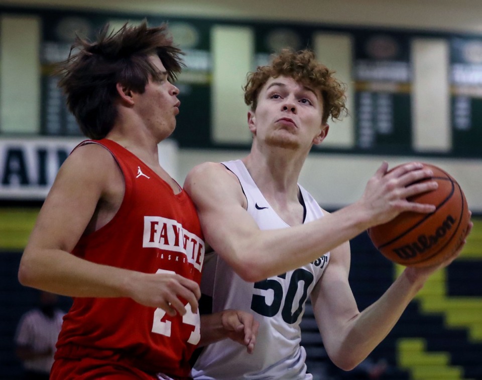 <strong>Briarcrest guard Cooper Haynes (right) goes up for a layup during a June 8, 2021, summer game against Fayette Academy.</strong> (Patrick Lantrip/Daily Memphian file)
