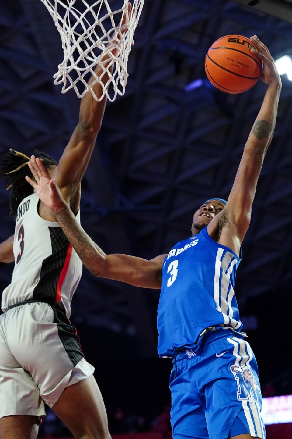 <strong>Memphis guard Landers Nolley II (right) goes up for a basket as Georgia guard Kario Oquendo defends on Wednesday, Dec. 1, in Athens, Ga.</strong> (John Bazemore/Associated Press)