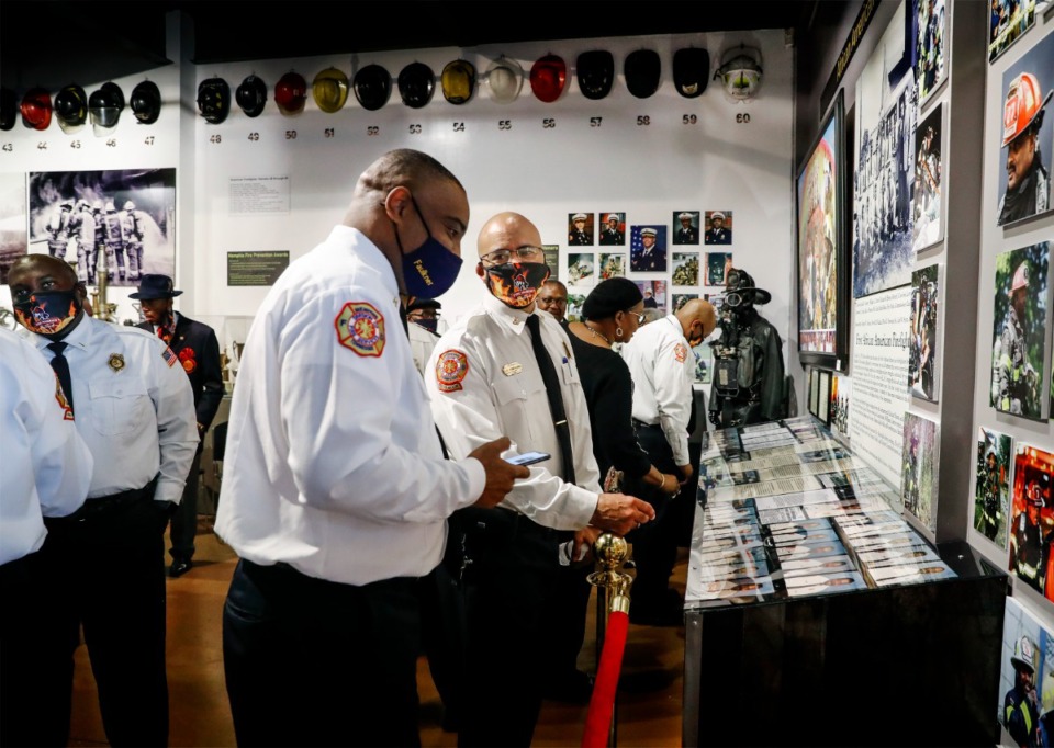 <strong>Current and former Memphis firefighters attend the grand opening of the African American Firefighters exhibit at the Fire Museum of Memphis. The exhibit, which opened Wednesday, Dec. 1, includes articles, photos, paintings and videos.</strong>&nbsp;(Mark Weber/Daily Memphian)