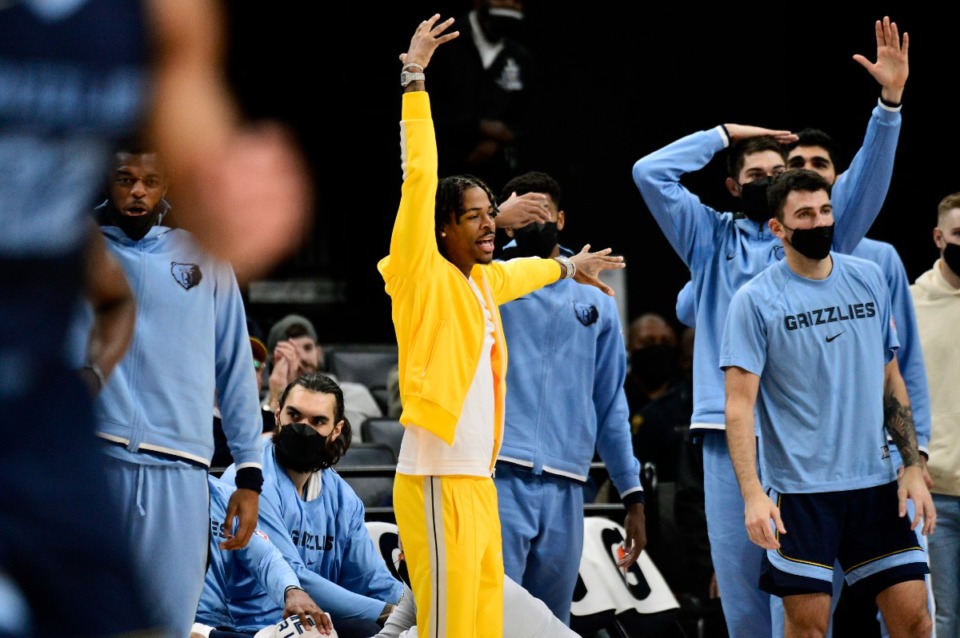 <strong>Memphis Grizzlies guard Ja Morant, center, reacts alongside teammates from the sideline in the first half of an NBA basketball game against the Sacramento Kings Sunday, Nov. 28, 2021, in Memphis, Tennessee.</strong> (AP Photo/Brandon Dill)