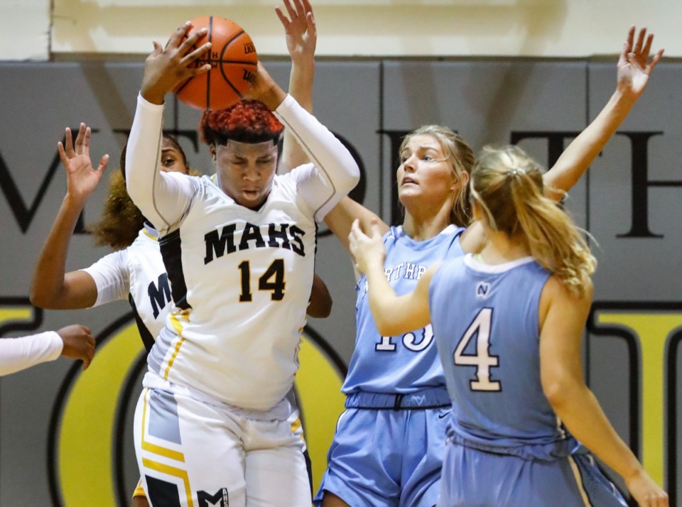 <strong>MAHS center Keveonna Benson (left) grabs a rebound against Northpoint on Friday, Dec. 3, 2021.</strong> (Mark Weber/The Daily Memphian)