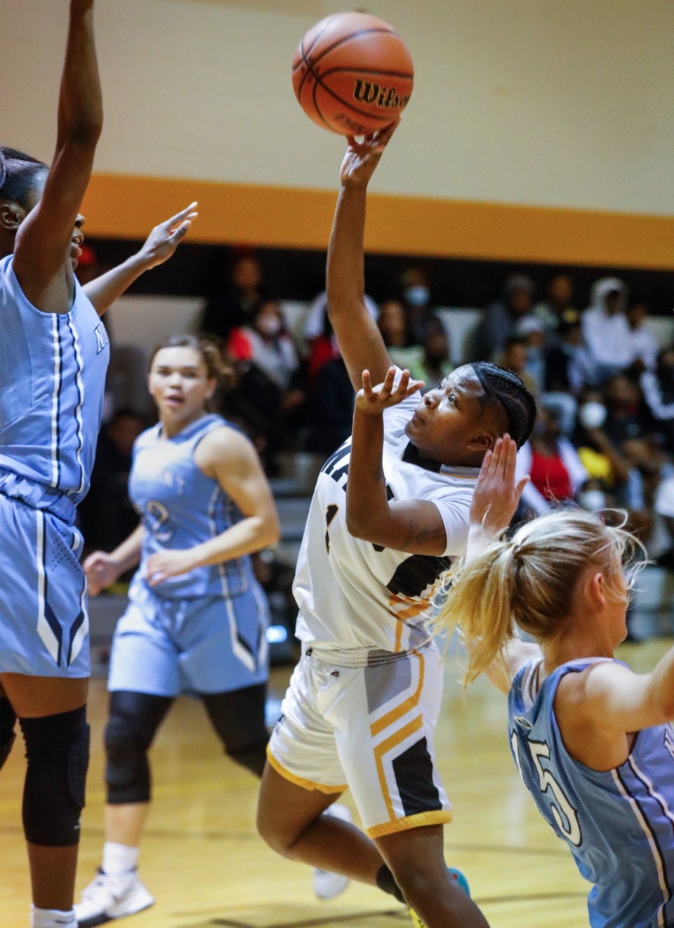 <strong>MAHS guard Kariah Parker (middle) puts up a shot against Northpoint on Friday, Dec. 3, 2021.</strong> (Mark Weber/The Daily Memphian)