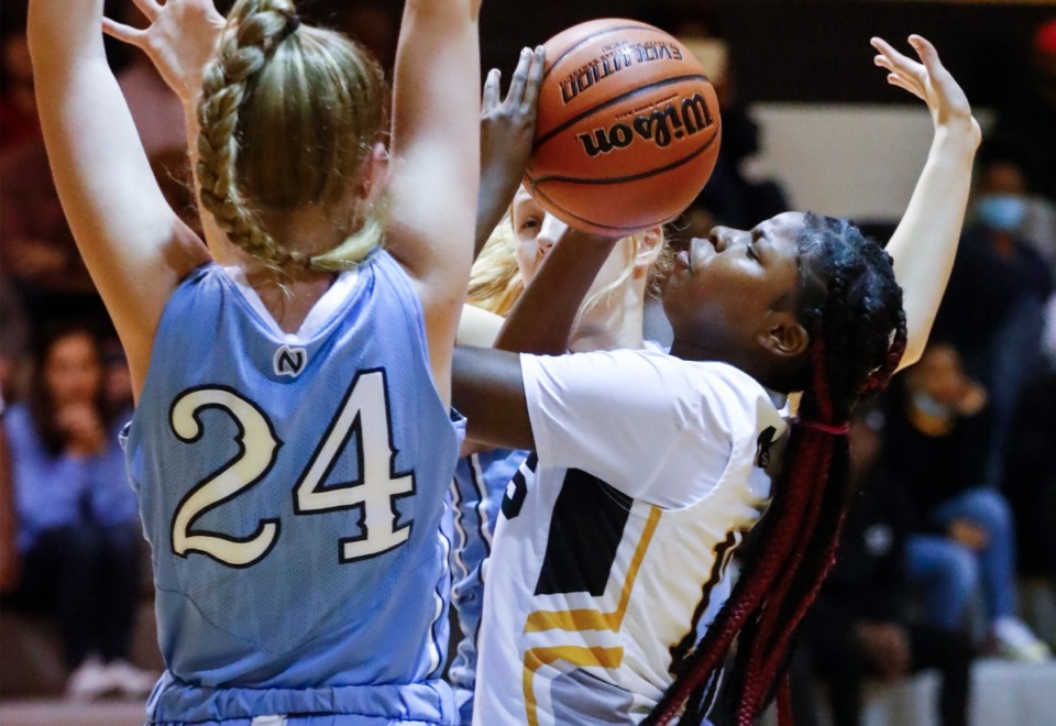 <strong>MAHS forward Tonya Bobo (right) puts up a shot against Northpoint&rsquo;s Hadley Carson (left) on Friday, Dec. 3, 2021.</strong> (Mark Weber/The Daily Memphian)