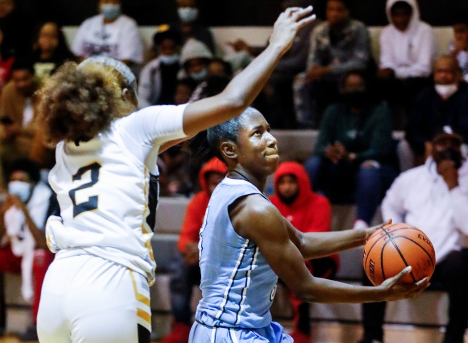 <strong>Northpoint guard Karrington Edwards (left) drives to the basket against MAHS&rsquo; Serenity Echols (left) on Friday, Dec. 3, 2021.</strong> (Mark Weber/The Daily Memphian)