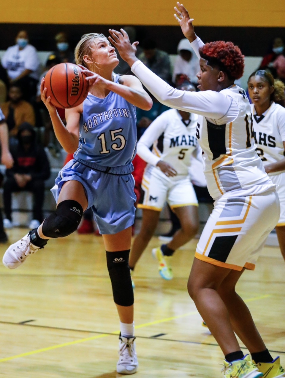 <strong>Northpoint forward Brylee Cherry (left) drives the lane against MAHS&rsquo; Keveonna Benson (right) on Friday, Dec. 3, 2021.</strong> (Mark Weber/The Daily Memphian)