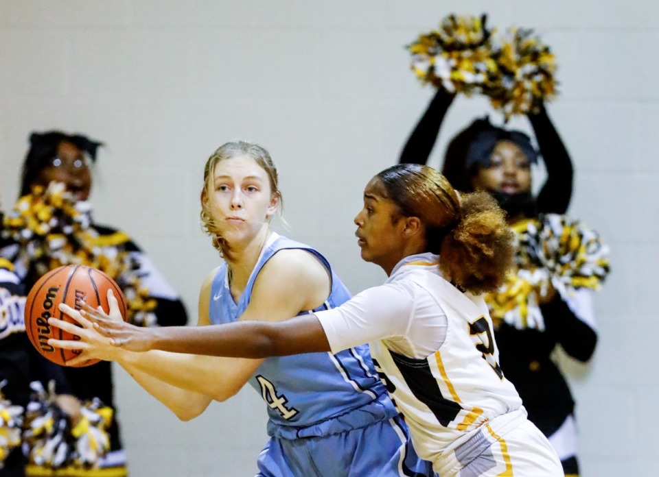 <strong>Northpoint forward Bethany Wright (left) looks to make a pass around MAHS&rsquo; Serenity Echols (right) on Friday, Dec. 3, 2021.</strong> (Mark Weber/The Daily Memphian)
