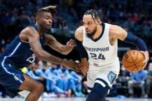 <strong>Memphis Grizzlies forward Dillon Brooks (24) controls the ball as Dallas Mavericks forward Reggie Bullock (25) defends during the first half of an NBA basketball game, Saturday, Dec. 4, 2021, in Dallas.</strong> (AP Photo/Sam Hodde)