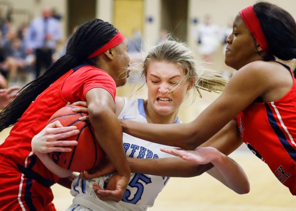 <strong>Northpoint Christian forward Brylee Faith Cherry battled Tipton-Rosemark Academy defenders Raven Sims (left) and Bri Hall (right) for a loose ball during their&nbsp; Division 2-A West Region postseason game last February. In addition to Cherry and Sims, other Player of the Week candidates are Mallory Taylor of White Station, Samara Jones of Trezevant, Abbey Jones of Hernando.</strong>&nbsp;(Mark Weber/The Daily Memphian file)