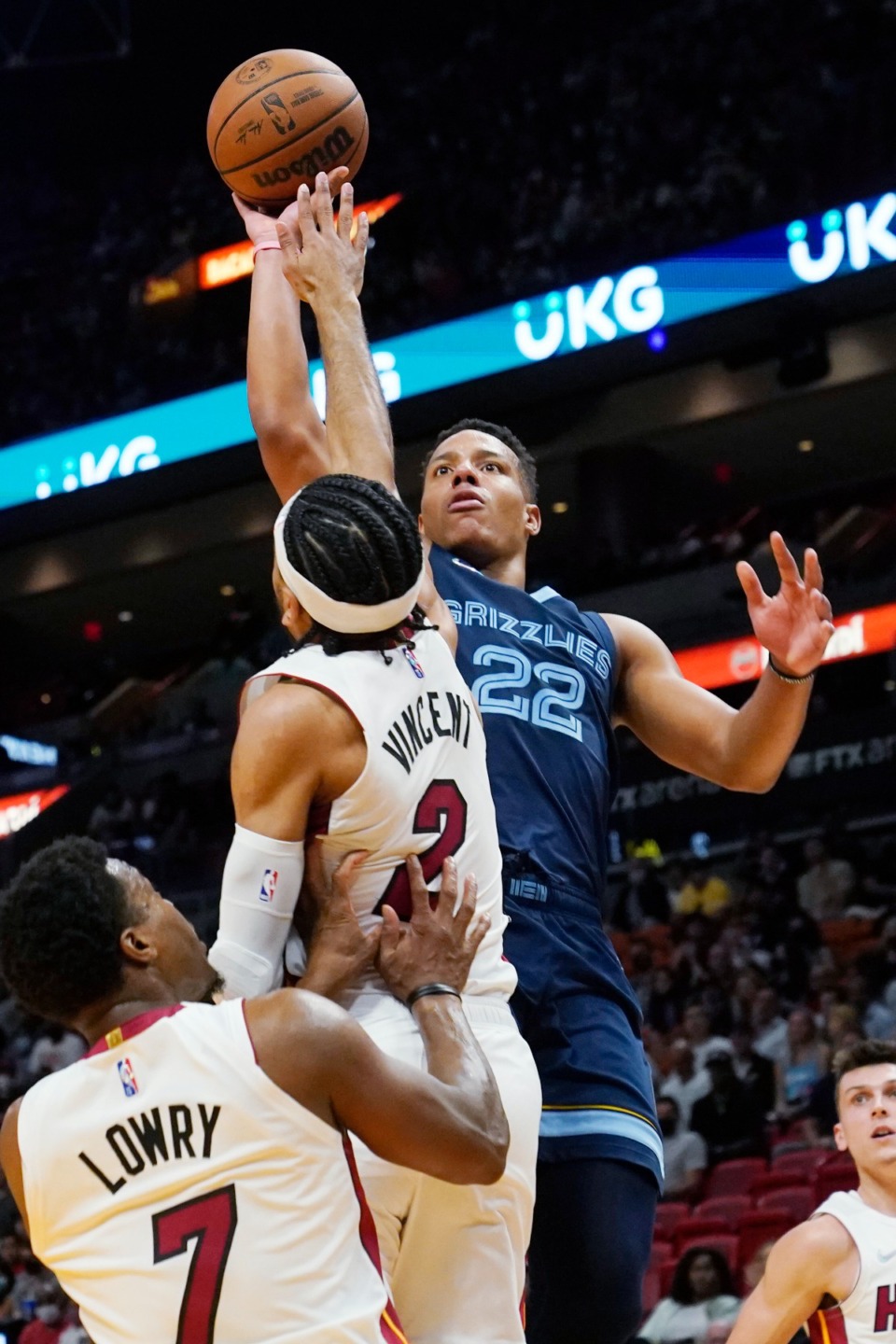 <strong>Grizzlies guard Desmond Bane (22) shoots over Miami Heat guards Gabe Vincent (2) and Kyle Lowry (7)&nbsp;on Dec. 6, 2021, in Miami.</strong> (Marta Lavandier/AP)