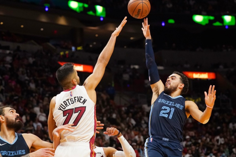 <strong>Grizzlies guard Tyus Jones (21) shoots over Miami Heat center Omer Yurtseven (77)</strong>&nbsp;<strong>on Dec. 6 in Miami.</strong> (Marta Lavandier/AP)