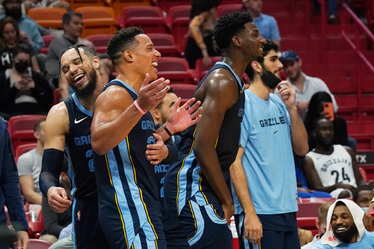 <strong>Grizzlies forward Dillon Brooks (24), left, guard Jarrett Culver, middle, and forward Jaren Jackson Jr., right, start celebrating at the end of the game against the Miami Heat</strong>&nbsp;<strong>on Dec. 6 in Miami.</strong> (Marta Lavandier/AP)