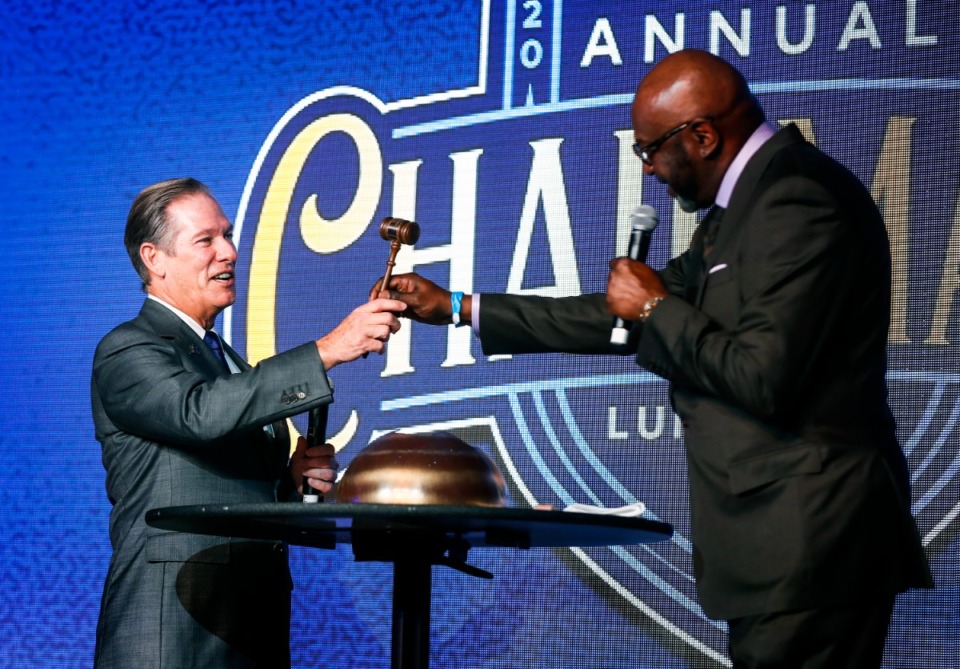 <strong>Incoming Greater Memphis Chamber chairman Doug Browne (left) receives a gavel from outgoing chairman Willie Gregory during the chamber's Annual Chairman's Luncheon on Tuesday, Dec. 7, at The Peabody.</strong> (Mark Weber/Daily Memphian)