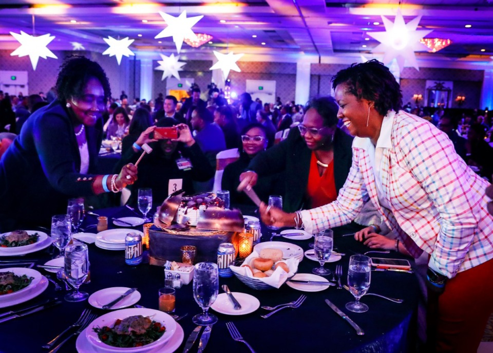 <strong>Attendees at the Greater Memphis Chamber's annual Chairman's Luncheon break open a chocolate dome on Tuesday, Dec. 7, at The Peabody.</strong> (Mark Weber/Daily Memphian)