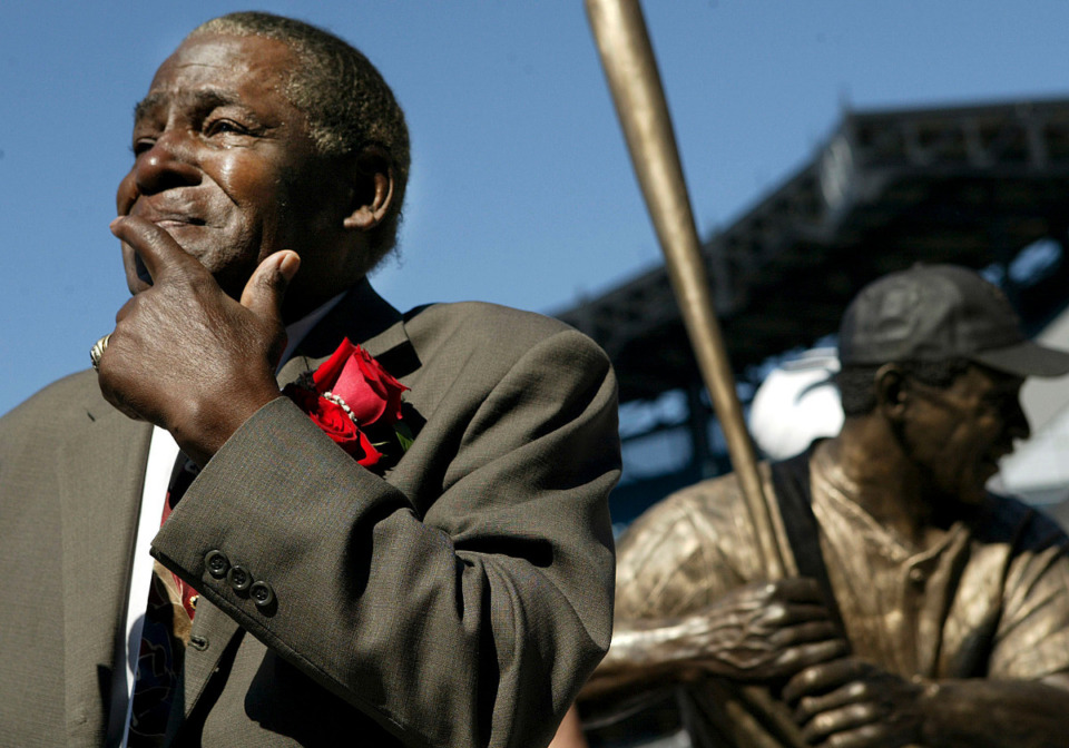 <strong>Minnie Minoso participates in the unveiling of a statue of himself before throwing out the ceremonial first fitch at U.S. Cellular Field before the game between Chicago White Sox and Detroit Tigers, Sunday, Sept. 19, 2004, in Chicago. Minoso has been elected into the Baseball Hall of Fame, Sunday, Dec. 5.</strong> (Nam Y. Huh/AP file)