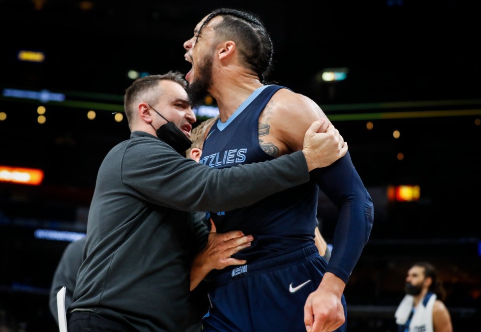 <strong>Grizzlies assistant coach Darko Rajakovic (left) holds back guard Dillion Brooks (right) as he shouts at an official in the game against the Dallas Mavericks on Wednesday, Dec. 8, 2021.</strong> (Mark Weber/The Daily Memphian)