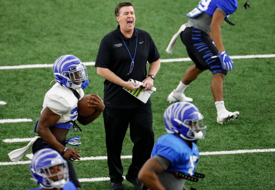 <strong>Former Memphis defensive coordinator Mike MacIntyre (middle) during practice on Tuesday, March 23, 2021.&nbsp;MacIntyre was officially announced as the new FIU head coach by athletic director Scott Carr Dec. 9.</strong> (Mark Weber/The Daily Memphian)