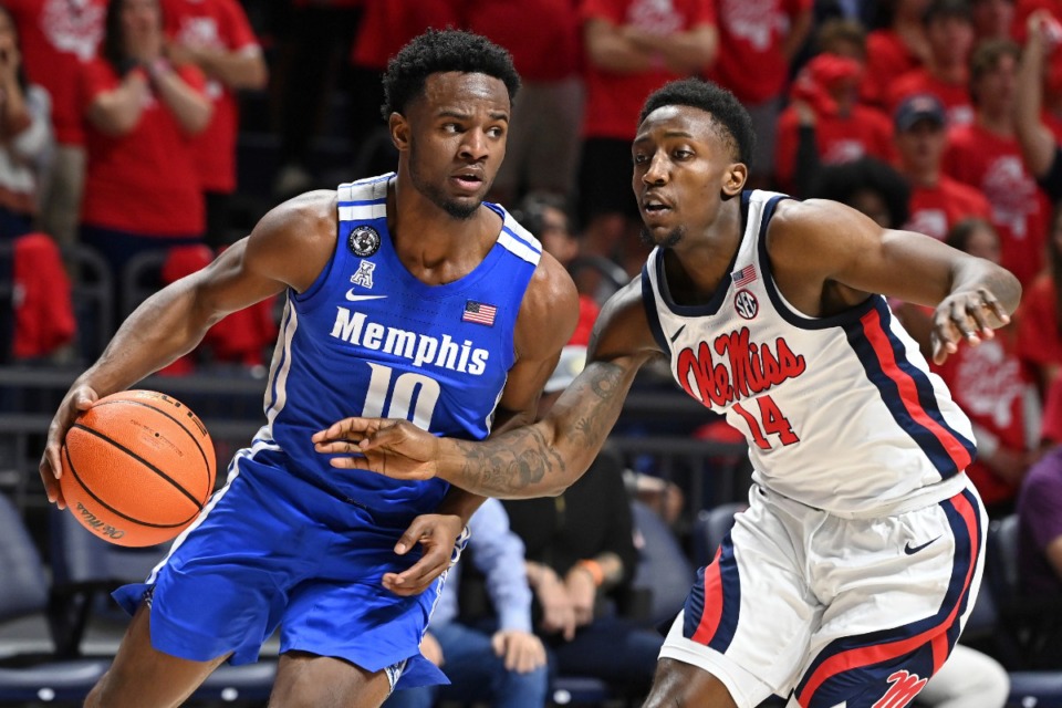 <strong>Memphis guard Alex Lomax (10) drives the ball past Mississippi guard Tye Fagan (14) during the first half of an an NCAA college basketball game in Oxford, Mississippi, Saturday, Dec. 4, 2021.</strong> (AP Photo/Thomas Graning)