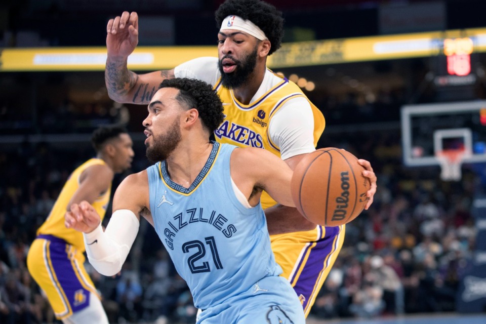<strong>Grizzlies guard Tyus Jones (21) drives as Los Angeles Lakers forward Anthony Davis defends</strong>&nbsp;<strong>on Dec. 9 at FedExForum.</strong> (Nikki Boertman/AP)