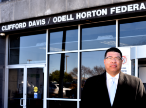 <strong>Odell Horton Jr. stands outside the federal building named for his father and Clifford Davis, a former congressman and one-time member of the Ku Klux Klan. A bill signed by President Biden renamed the building solely for Odell Horton Sr.</strong> (Ben Wheeler/Institute for Public Service Reporting)