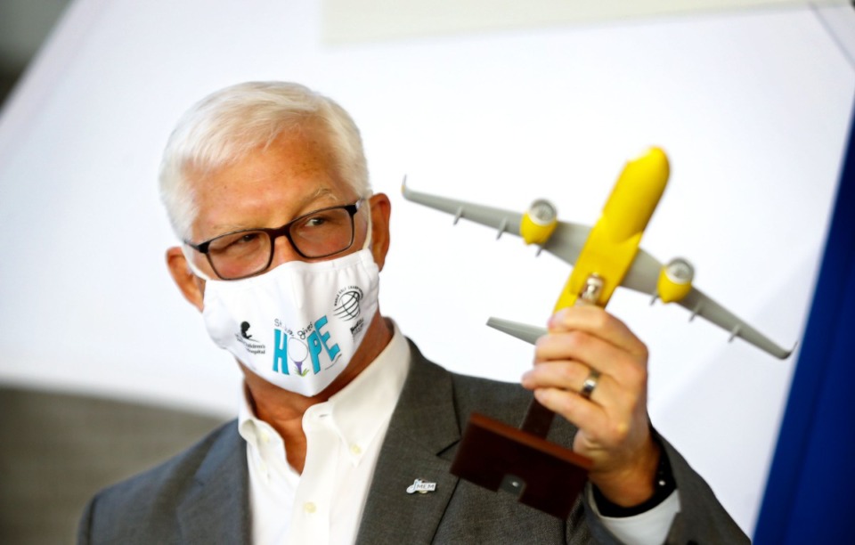 <strong>Memphis International Airport CEO Scott Brockman checks out his new model Spirit Airlines plane he got during a Dec. 14, 2021 press conference announcing the company's entry into the Memphis market.</strong> (Patrick Lantrip/Daily Memphian)