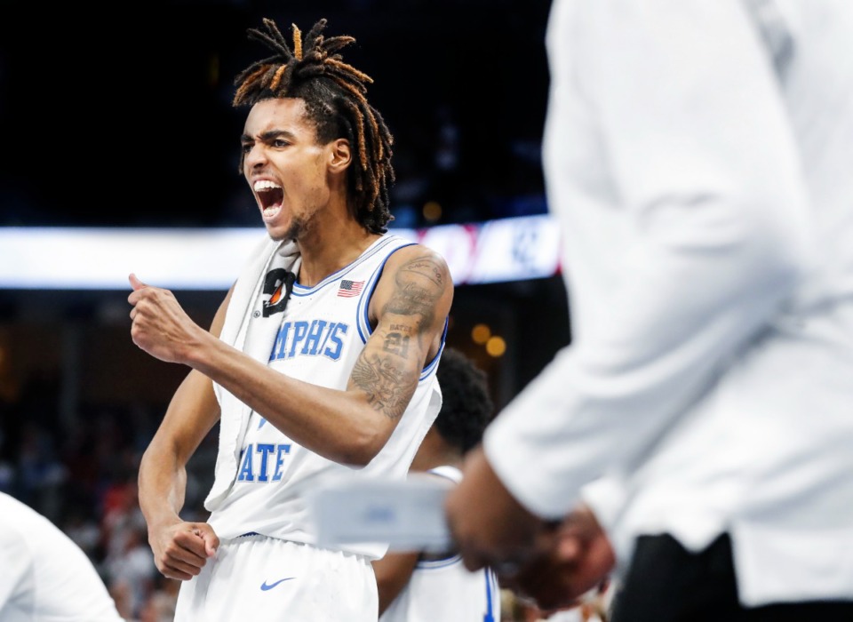 <strong>Tigers guard Emoji Bates celebrates on the bench in the game against Alabama on Tuesday, Dec. 14, 2021.</strong> (Mark Weber/The Daily Memphian)