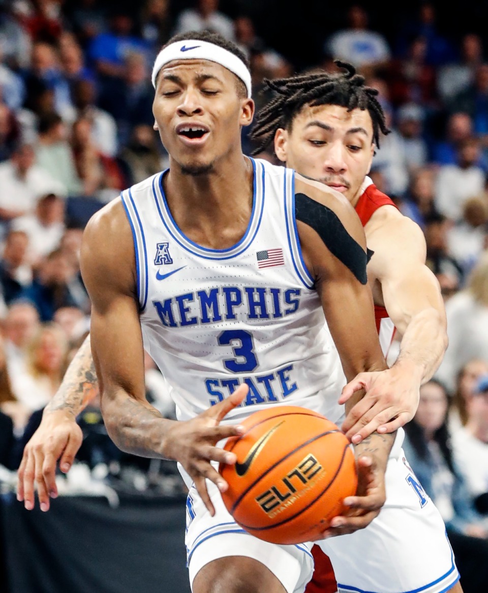 <strong>Tigers guard Landers Nolley II (front) drives the lane against Alabama&rsquo;s Jahvon Quinerly (back) on Tuesday, Dec. 14, 2021.</strong> (Mark Weber/The Daily Memphian)