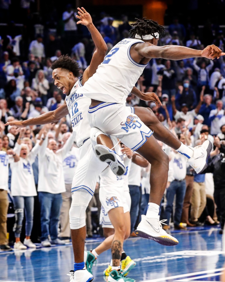 <strong>Tigers teammates DeAndre Williams (left) and Jalen Duren (right) celebrate the victory over Alabama on Tuesday, Dec. 14, 2021.</strong> (Mark Weber/The Daily Memphian)