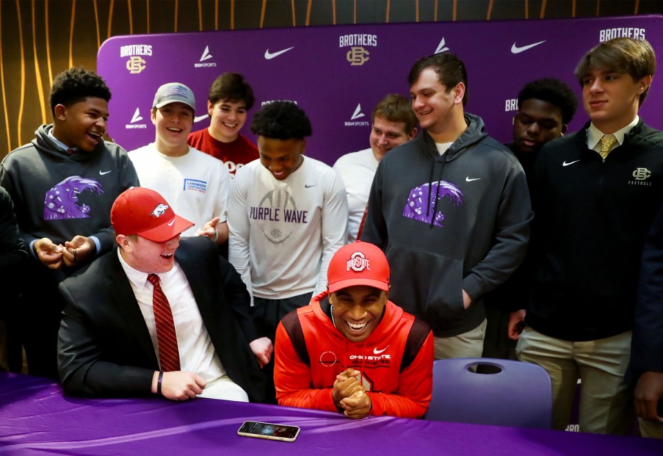 <strong>Ohio State University commit Dallan Hayden (right) and teammate and University of Arkansas commit Patrick Kutas Jr. share a laugh with their Christian Brothers High classmates during a signing day event at the school on Wednesday, Dec. 15.</strong> (Patrick Lantrip/Daily Memphian)