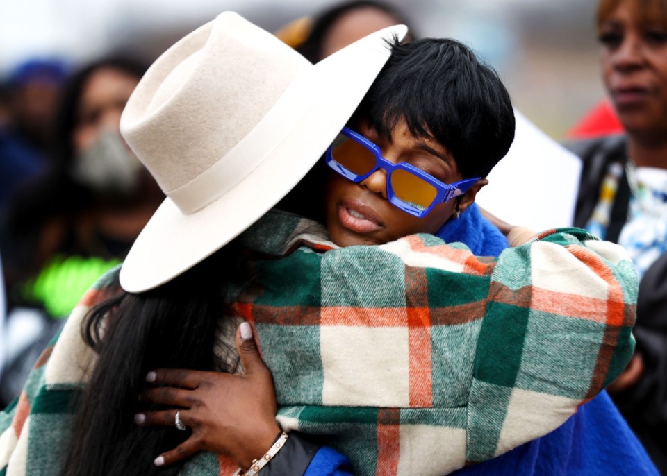 <strong>Young Dolph&rsquo;s partner, Mia Jerdine, (right) hugs a friend after speaking at a street naming ceremony in South Memphis honoring the slain rapper on Wednesday, Dec. 15.</strong> (Patrick Lantrip/Daily Memphian)