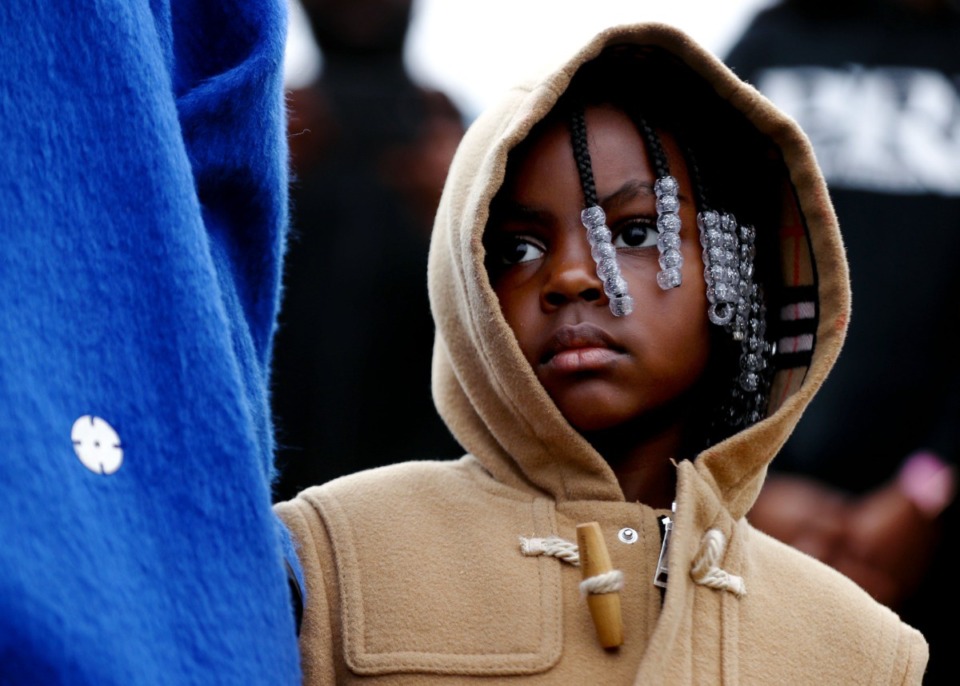 <strong>Young Dolph&rsquo;s daughter, Aria, watches her mother, Mia Jerdine, speak at a street naming ceremony honoring Young Dolph in South Memphis on Wednesday, Dec. 15.</strong> (Patrick Lantrip/Daily Memphian)