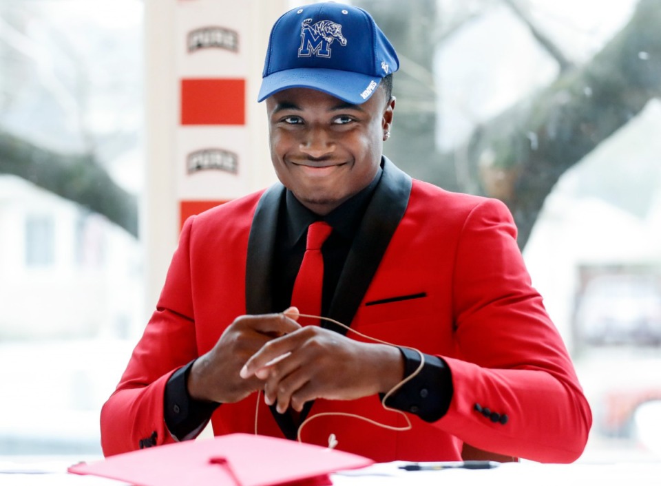 <strong>PURE Youth Academy quarterback Tevin Carter smiles on Wednesday, Dec. 15, 2021 during a signing day party,&nbsp;after announcing he will be attending the University of Memphis.</strong> (Mark Weber/The Daily Memphian)