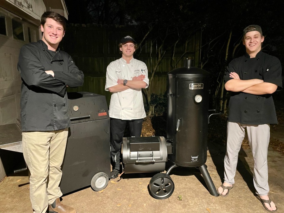 <strong>Five friends, including (from left) Rob Stukenborg, Addison Forsdick and Robert Hammons, are out to break a Guinness World Record for longest barbecue for a team. They&rsquo;re cooking 8 a.m. Dec. 17-8 a.m. Dec. 19.</strong> (Courtesy Rob Stukenborg)