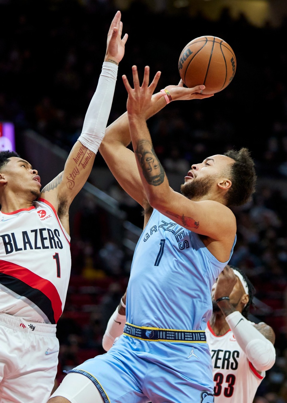 <strong>Grizzlies forward Kyle Anderson, right, shoots over Portland Trail Blazers guard Anfernee Simons</strong>&nbsp;<strong>on Dec. 15, 2021.</strong> (Craig Mitchelldyer/AP)