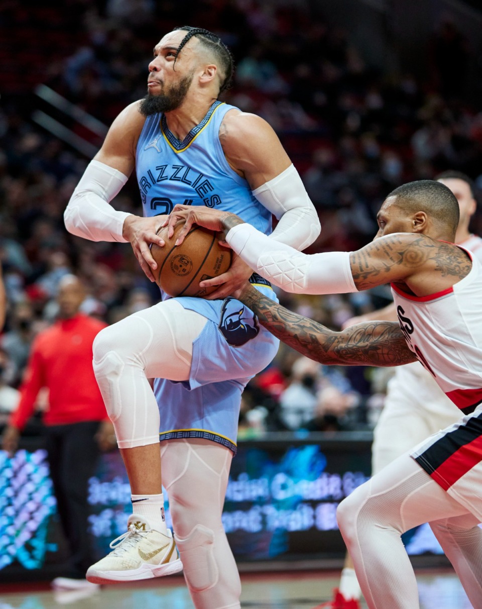 <strong>Grizzlies forward Dillon Brooks, left, has the ball tied up by Portland Trail Blazers guard Damian Lillard during</strong>&nbsp;<strong>on Dec. 15, 2021.</strong> (Craig Mitchelldyer/AP)