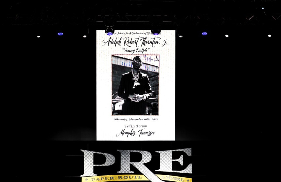 <strong>A memorial card is displayed on the stage of the FedExForum during a celebration of life event for Young Dolph Dec. 16, 2021.</strong> (Patrick Lantrip/Daily Memphian)
