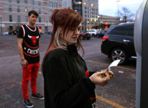 <strong>Danica Cissell and Justin Vogel pay for parking in Downtown Memphis Wednesday, Feb. 27, 2019, after driving in from Dresden, Tennessee, to see their Chicago Bulls take on the Memphis Grizzlies. While Memphians have expressed the desire for more Downtown parking, the city is working toward a culture shift of getting drivers to pay higher rates and walk farther to park.</strong>&nbsp;(Patrick Lantrip/Daily Memphian)